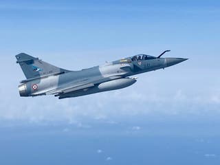 A picture shows a French Mirage 2000 fighter jet flying over Estonia