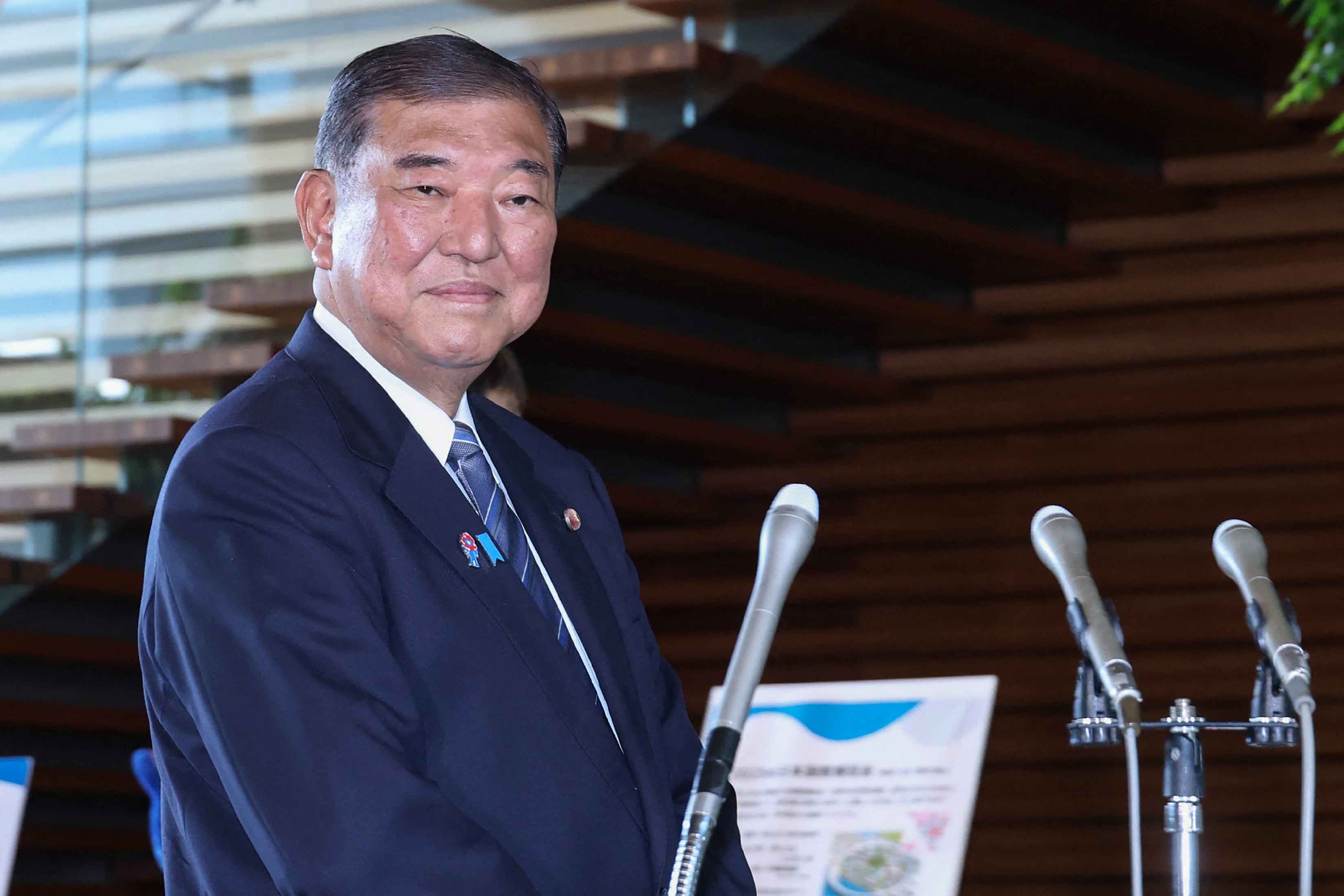Japan's prime minister Shigeru Ishiba meets with members of the media following the announcement of a Japan-US tariff agreement, at the prime minister's office in Tokyo on 23 July 2025