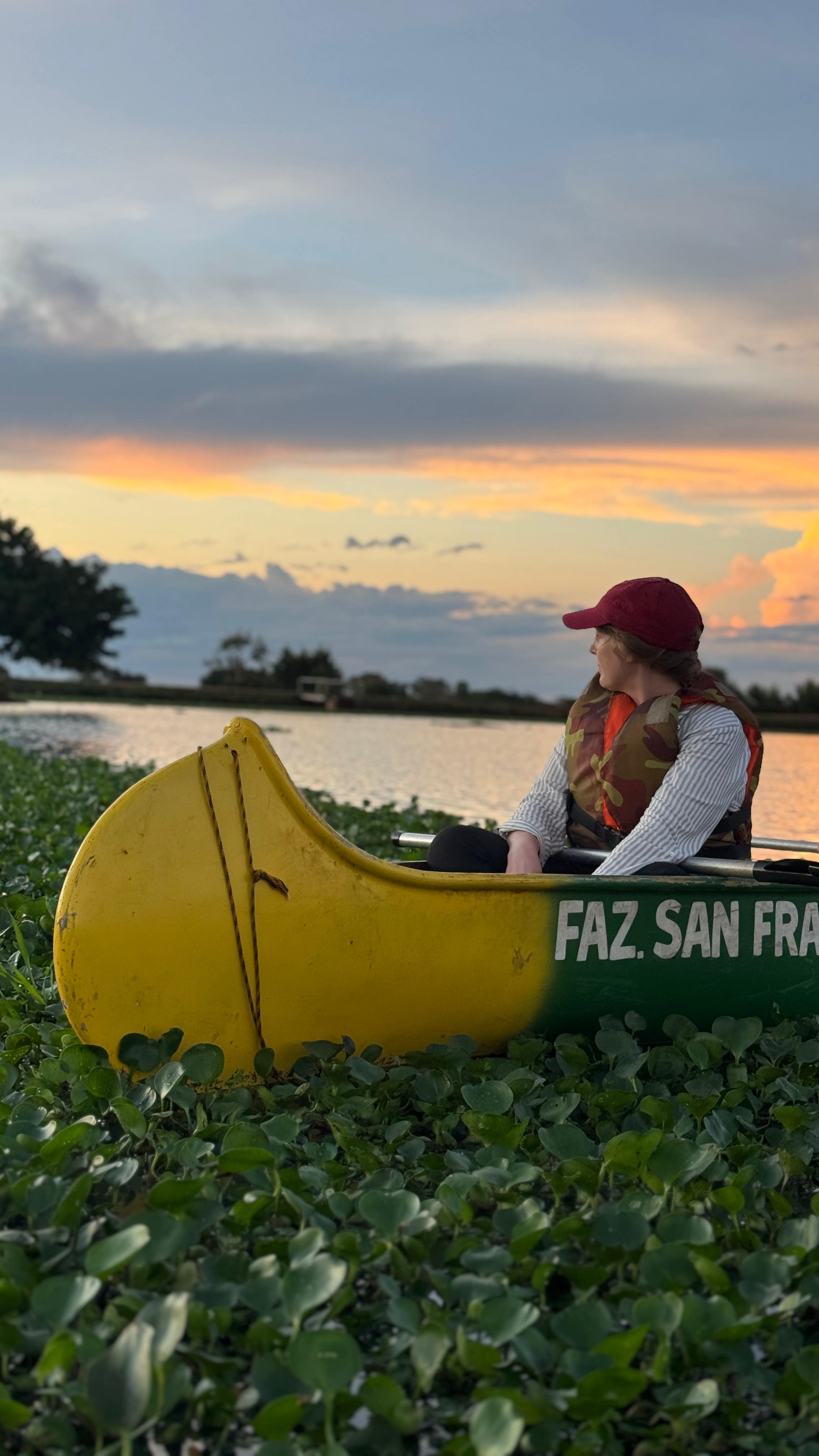 Writer, Steph Dyson, on a canoe exploring the Brazilian Pantanal