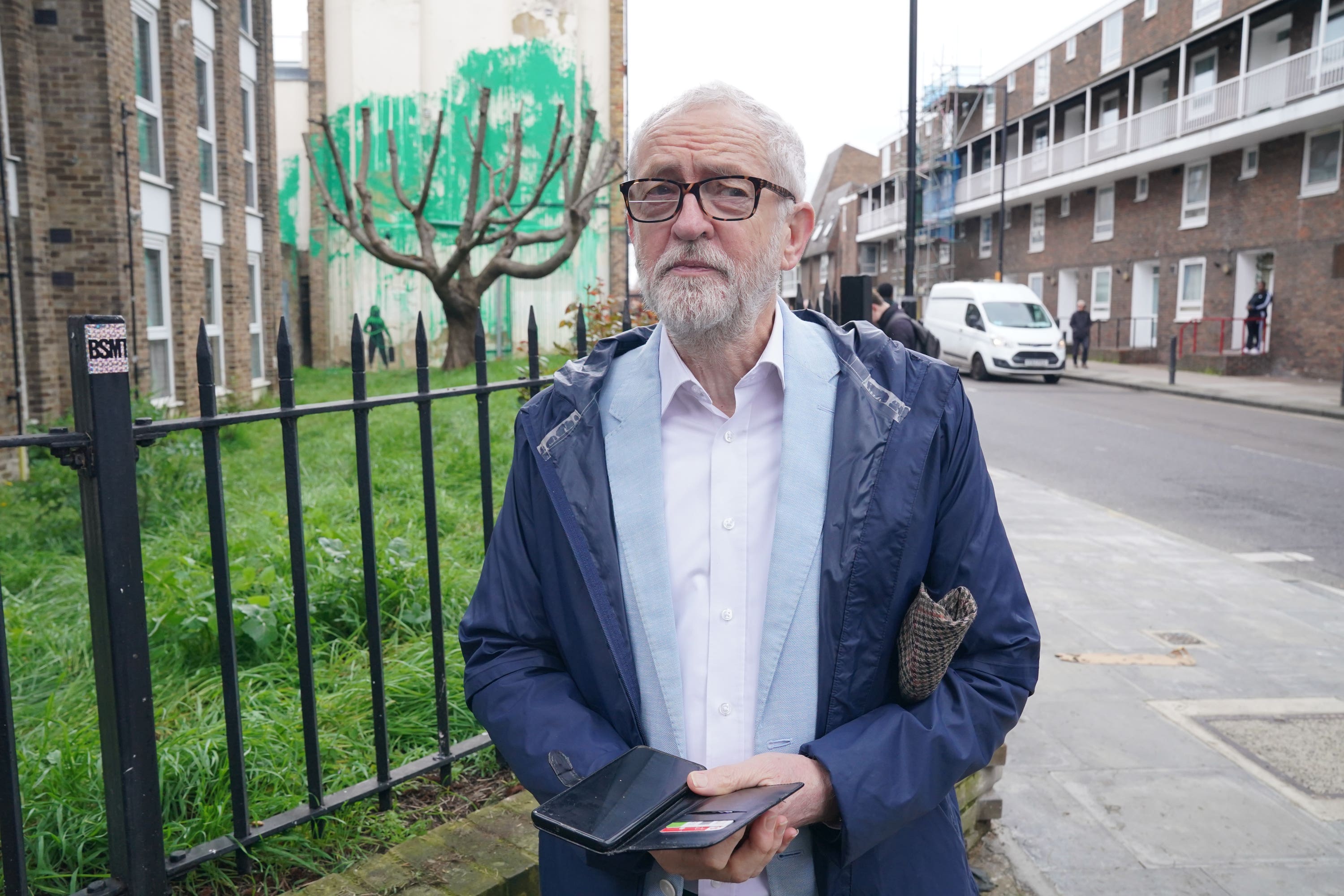 Former Labour Party leader Jeremy Corbyn, arrives to view a tree mural which appeared overnight on a residential building on Hornsey Road in Finsbury Park, London, confirmed by the anonymous street artist Banksy, as one of his own in an Instagram post on Monday. Picture date: Monday March 18, 2024.