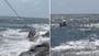 Ten people rescued after sailboat hits rocks on Jersey shore