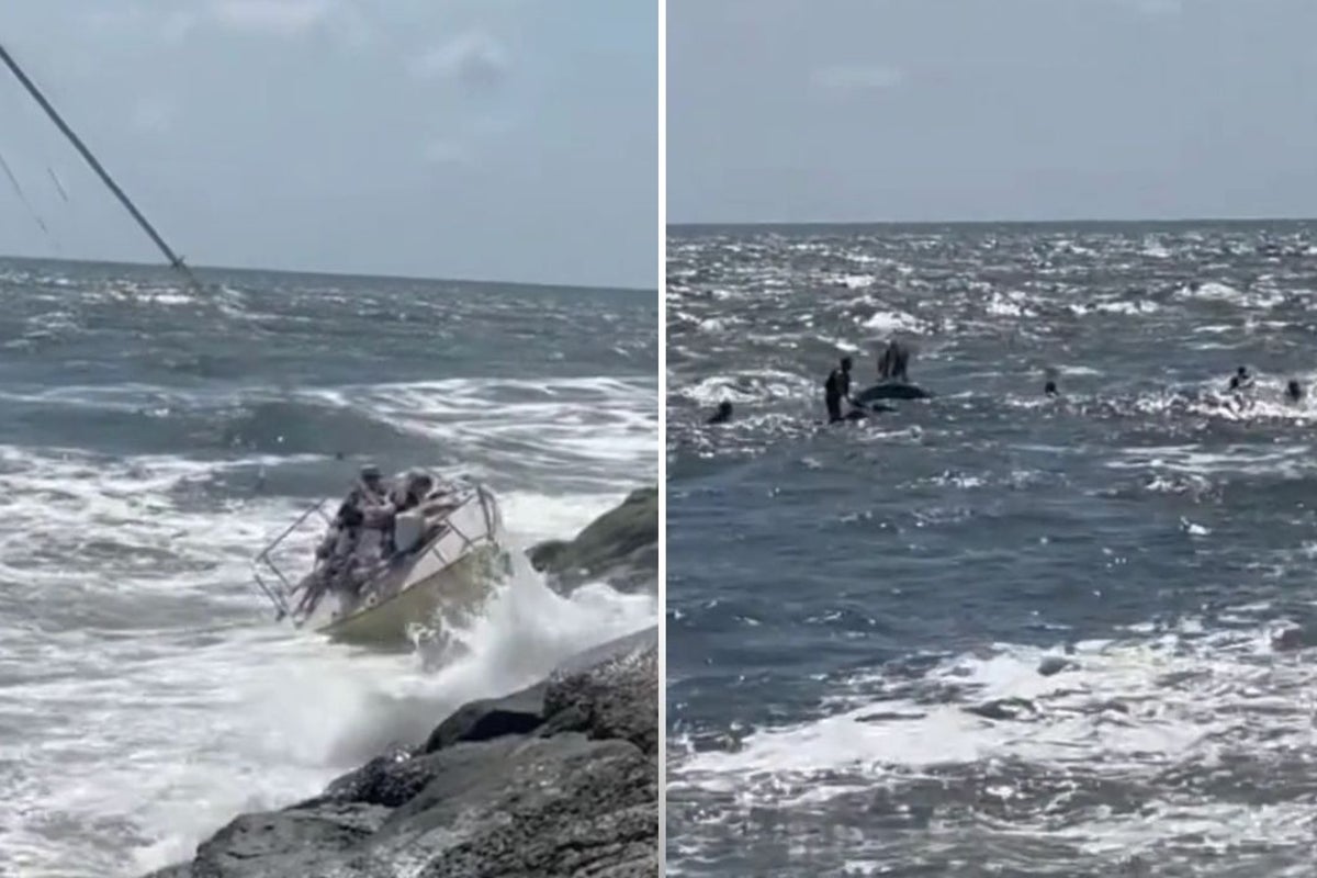 Ten people rescued after sailboat giving lesson to teenagers is smashed onto rocks on the Jersey shore