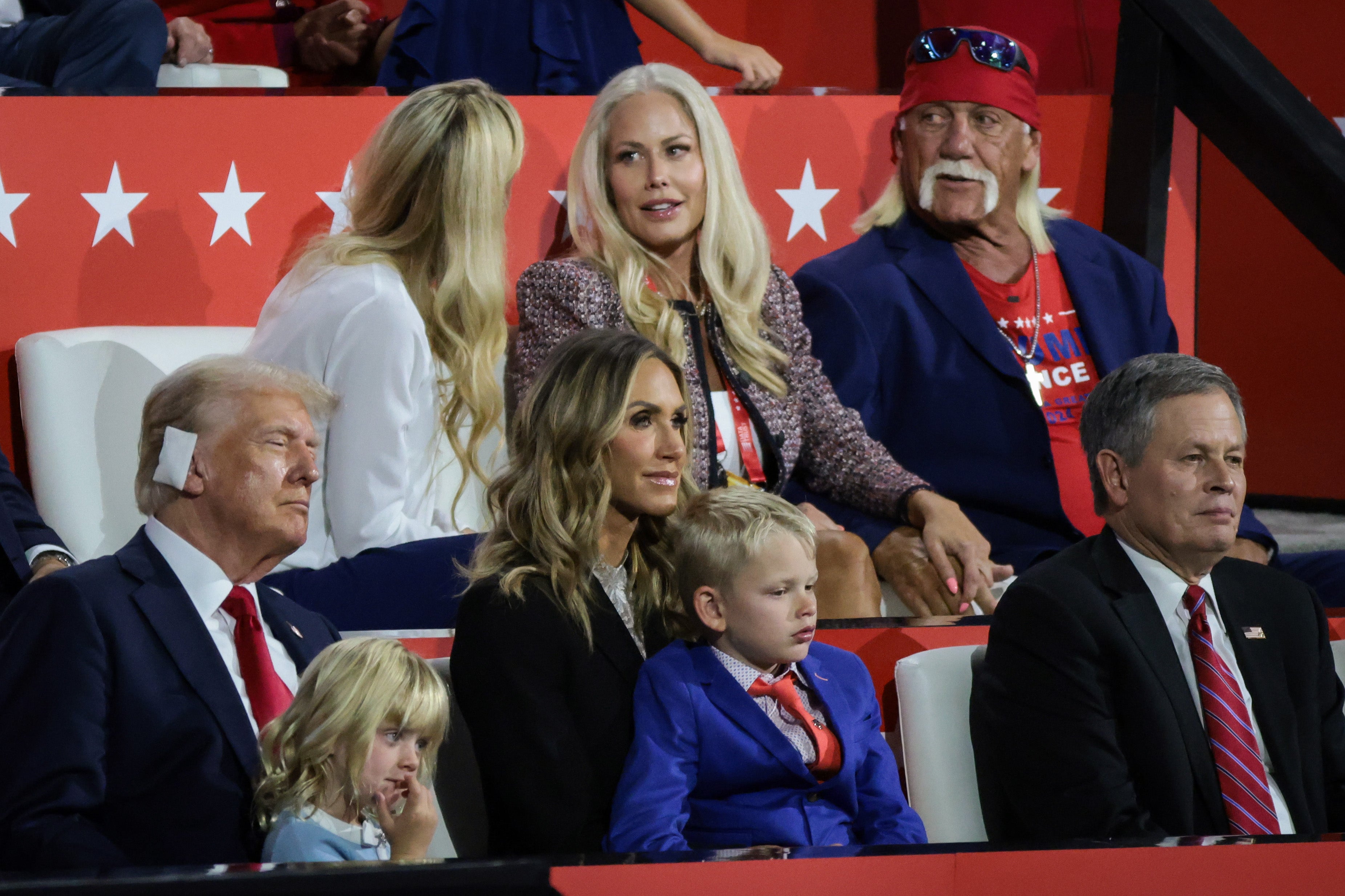 Hogan with members of the Trump family during last summer’s Republican convention as Trump bears bandage on ear from assassination attempt a week earlier
