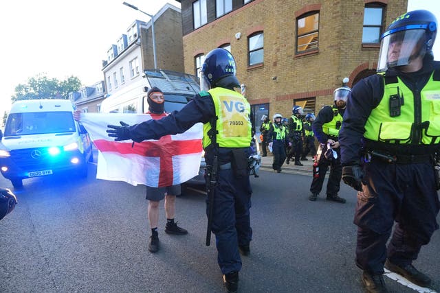 Protesters and police outside the Bell Hotel on Sunday (Yui Mok/PA)