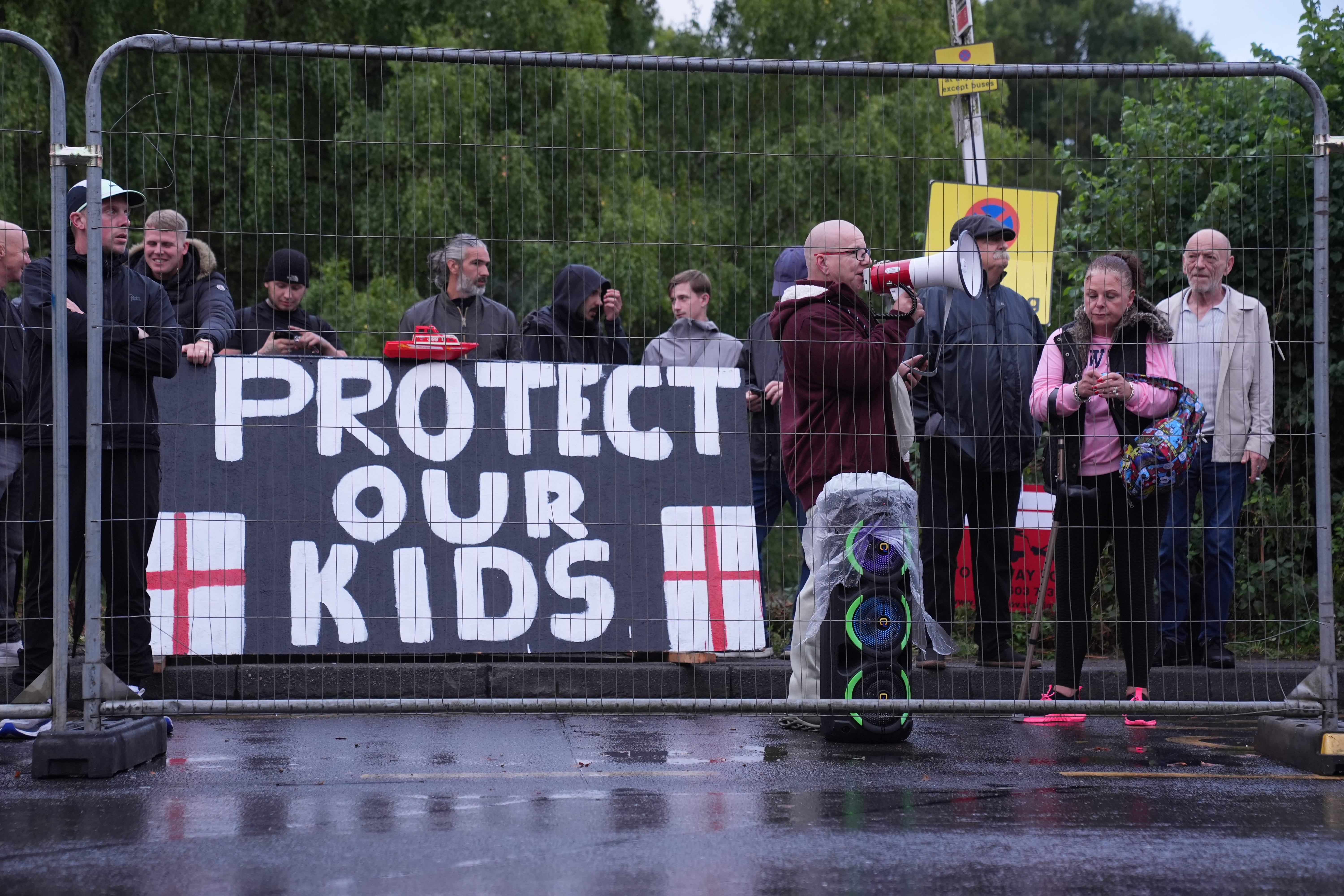 Protesters outside the Bell Hotel on Thursday (Lucy North/PA)