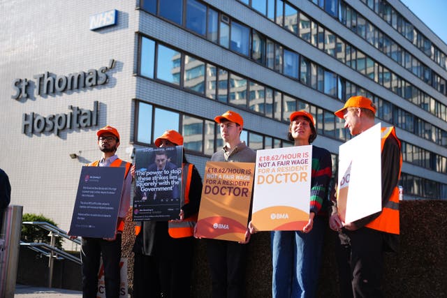<p>Resident doctors on a picket line outside St Thomas’ Hospital in London</p>