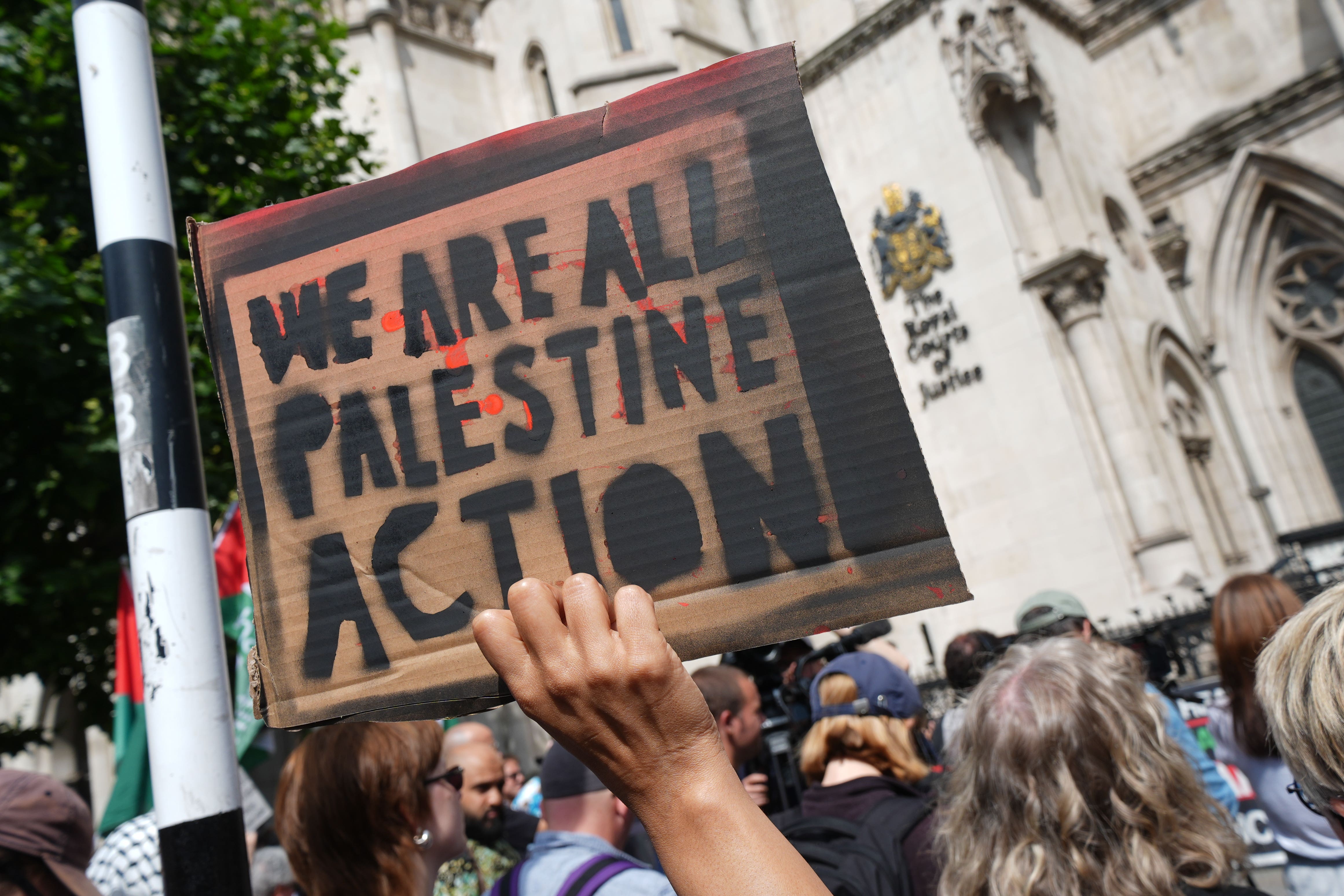 Protesters outside the Royal Courts of Justice on The Strand, central London, where a hearing over whether the proscribing of Palestine Action should be temporarily blocked (Lucy North/PA)