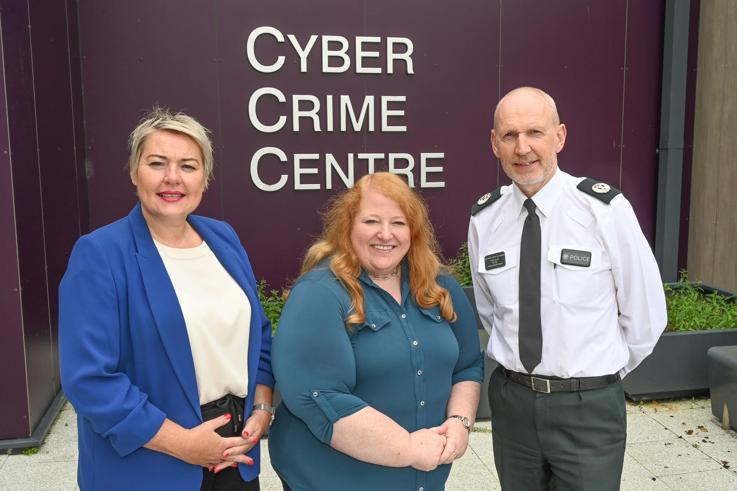 Justice Minister Naomi Long, centre, at the PSNI Cyber Crime Centre with Assistant Chief Constable Davy Beck and Detective Chief Superintendent Emma Neill, who has responsibility for the centre (PA)