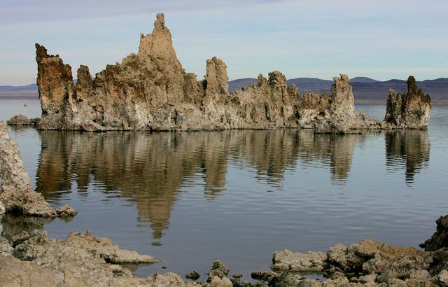 <p>FILE - Tufa towers are reflected in Mono Lake near Lee Vining, Calif., Nov. 15, 2004. (AP Photo/Ben Margot, File)</p>