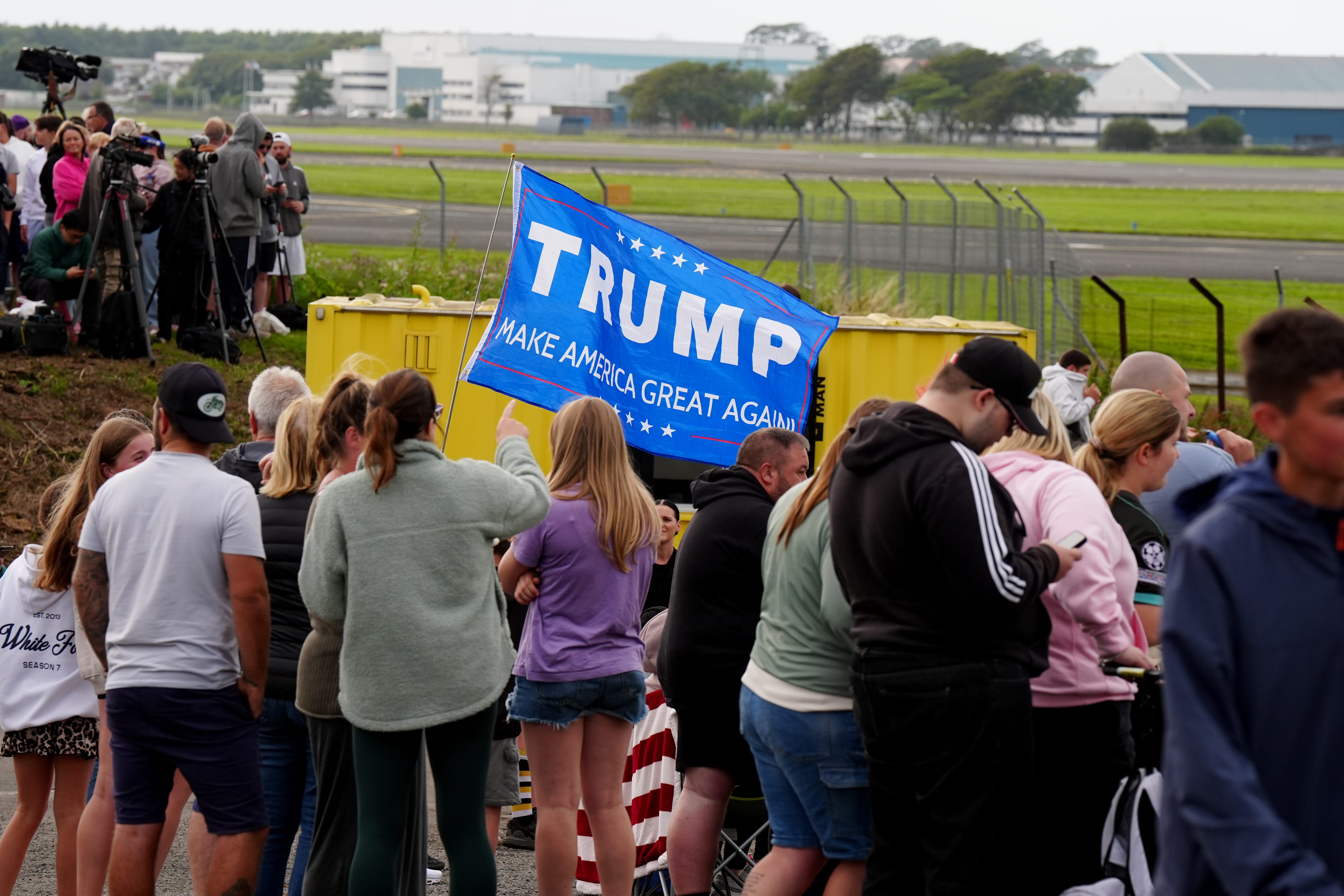 Trump supporters gather at Prestwick Airport ahead of US President Donald Trump’s arrival (Jane Barlow/PA)