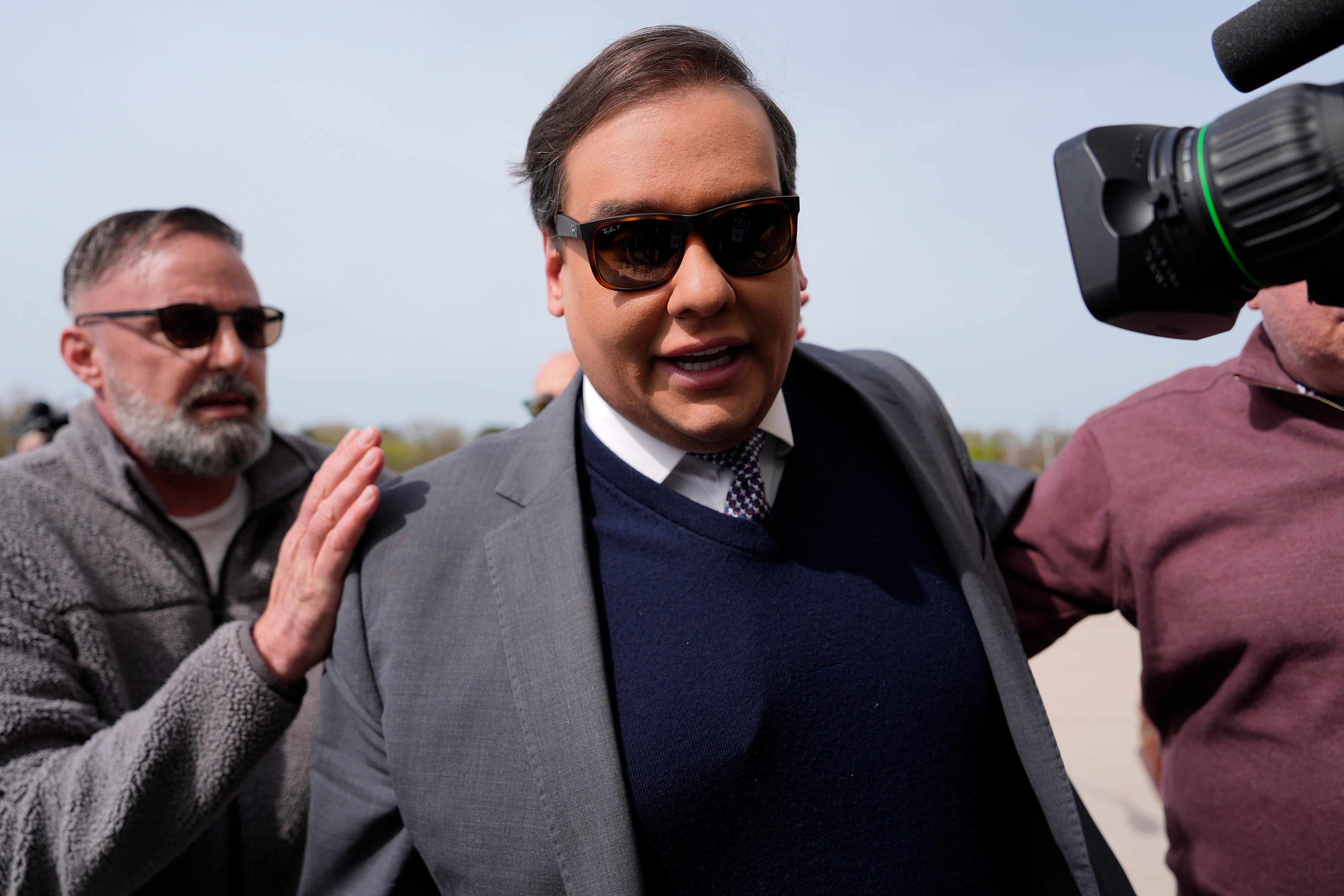 Former Representative George Santos reported to prison for a seven-year sentence Friday