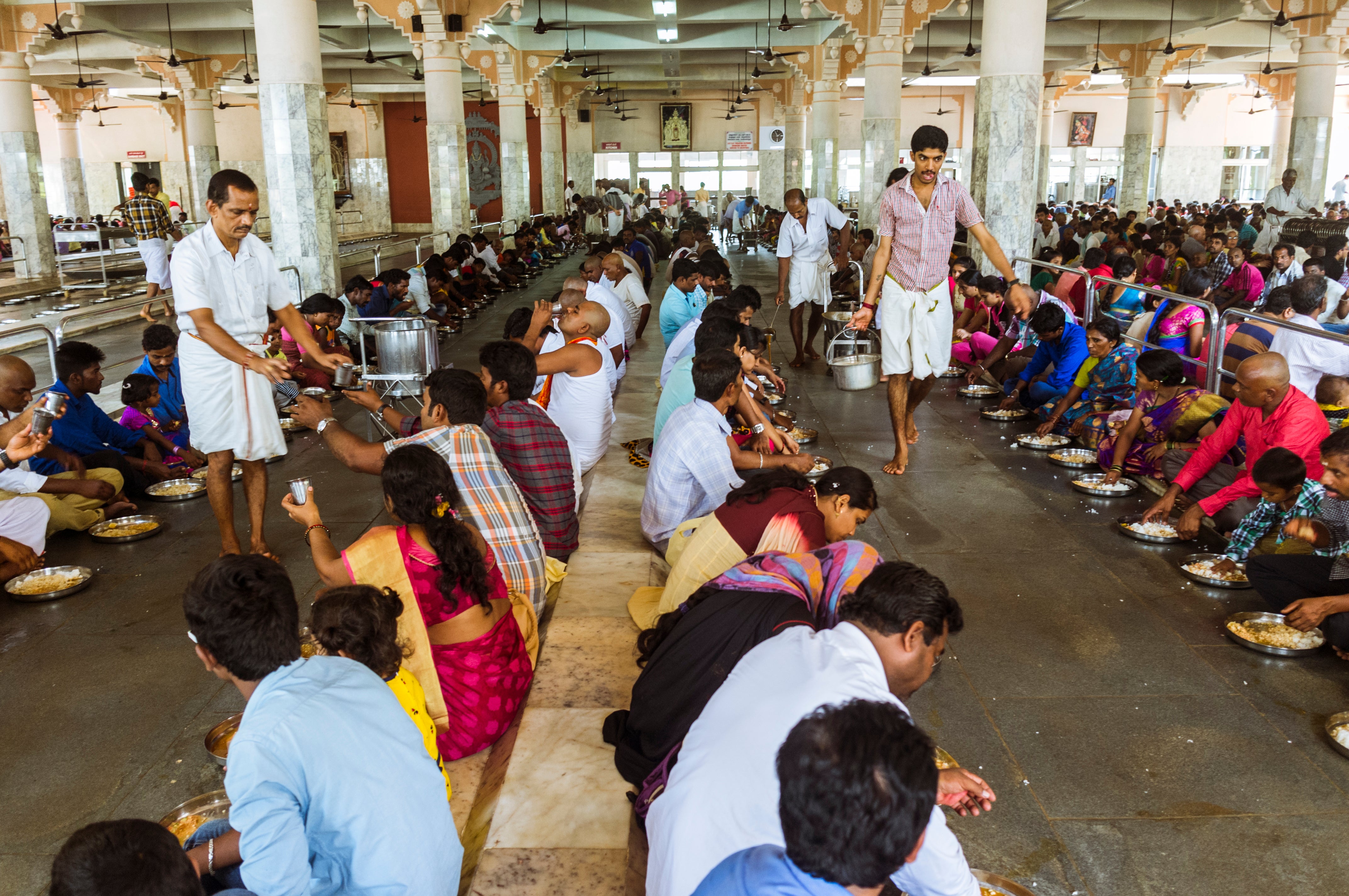File image shows food being served to hundreds of pilgrims at the Manjunatha Temple kitchen. Around 10.000 pilgrims pass through the temple every day