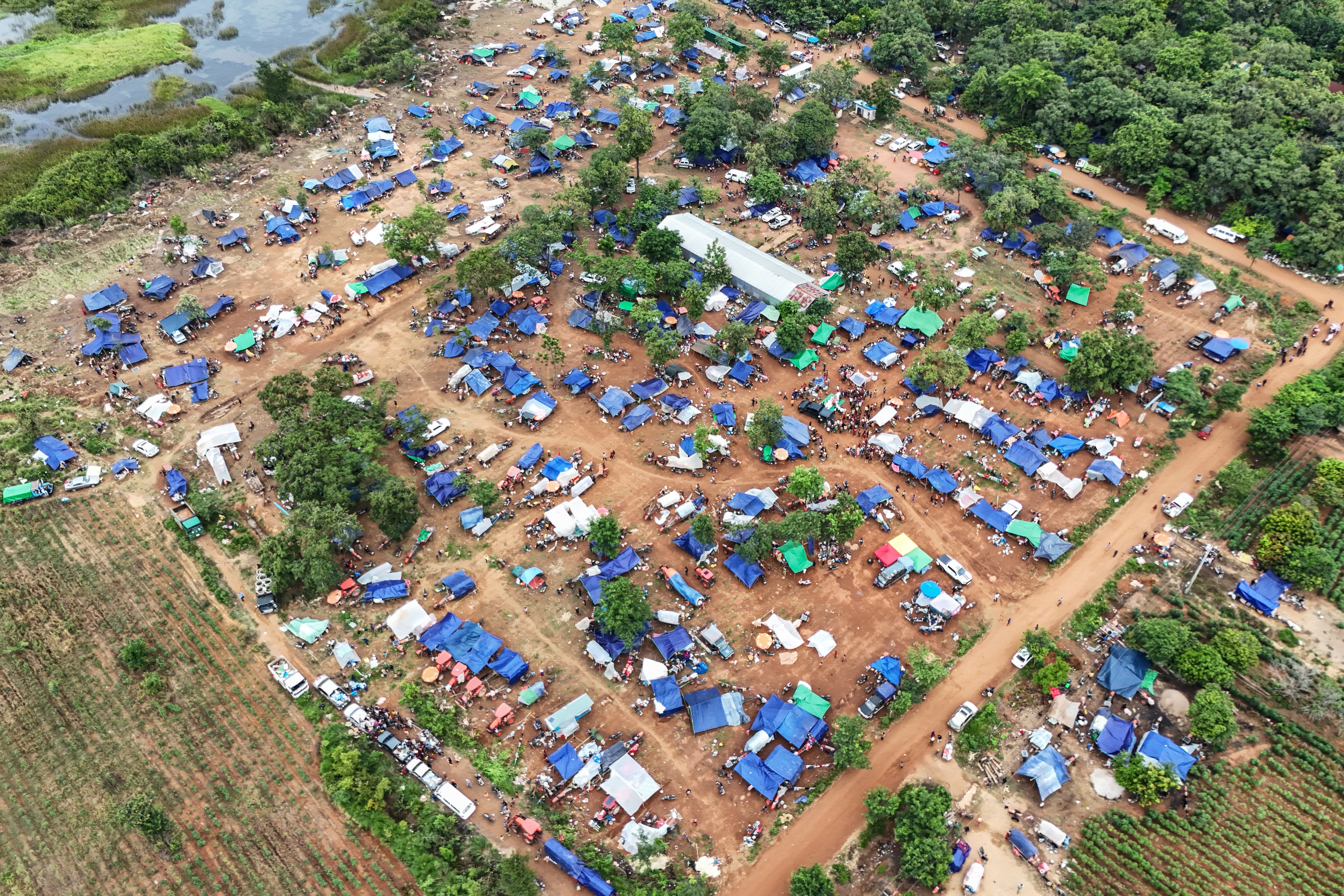 An aerial view shows displaced people taking shelter near a pagoda in Oddar Meanchey province of Cambodia