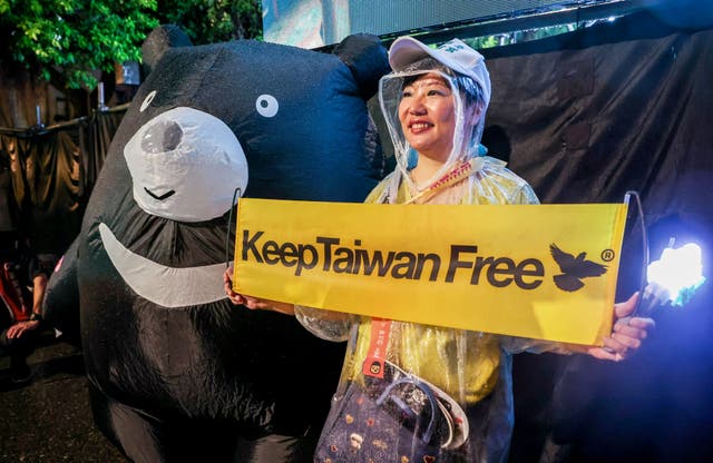 <p>A supporter participates in a pro-recall rally in front of the presidential hall in Taipei on July 24, 2025</p>