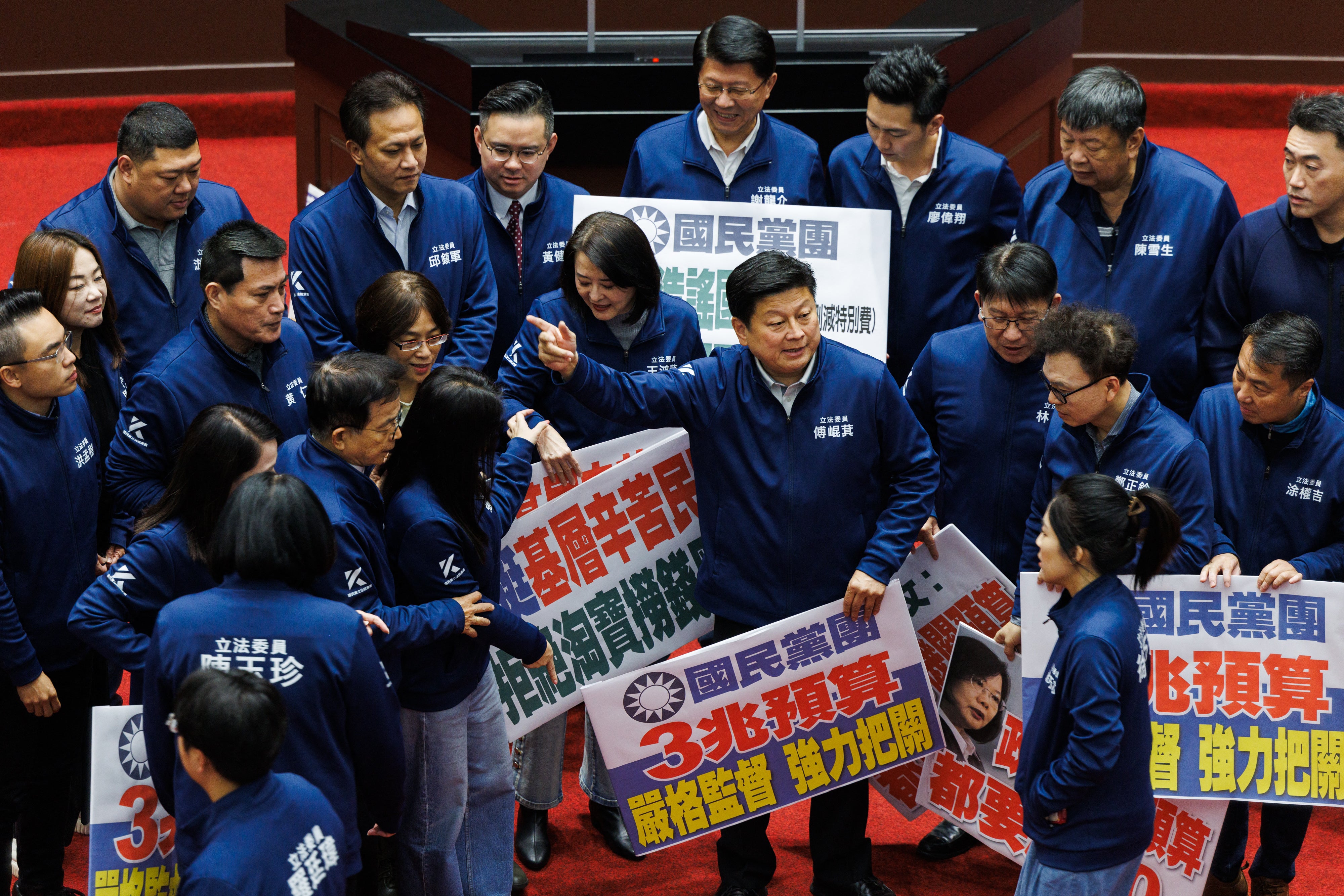 Opposition Kuomintang (KMT) legislators gesture during the central government budget for 2025 at Parliament in Taipei on January 21, 2025