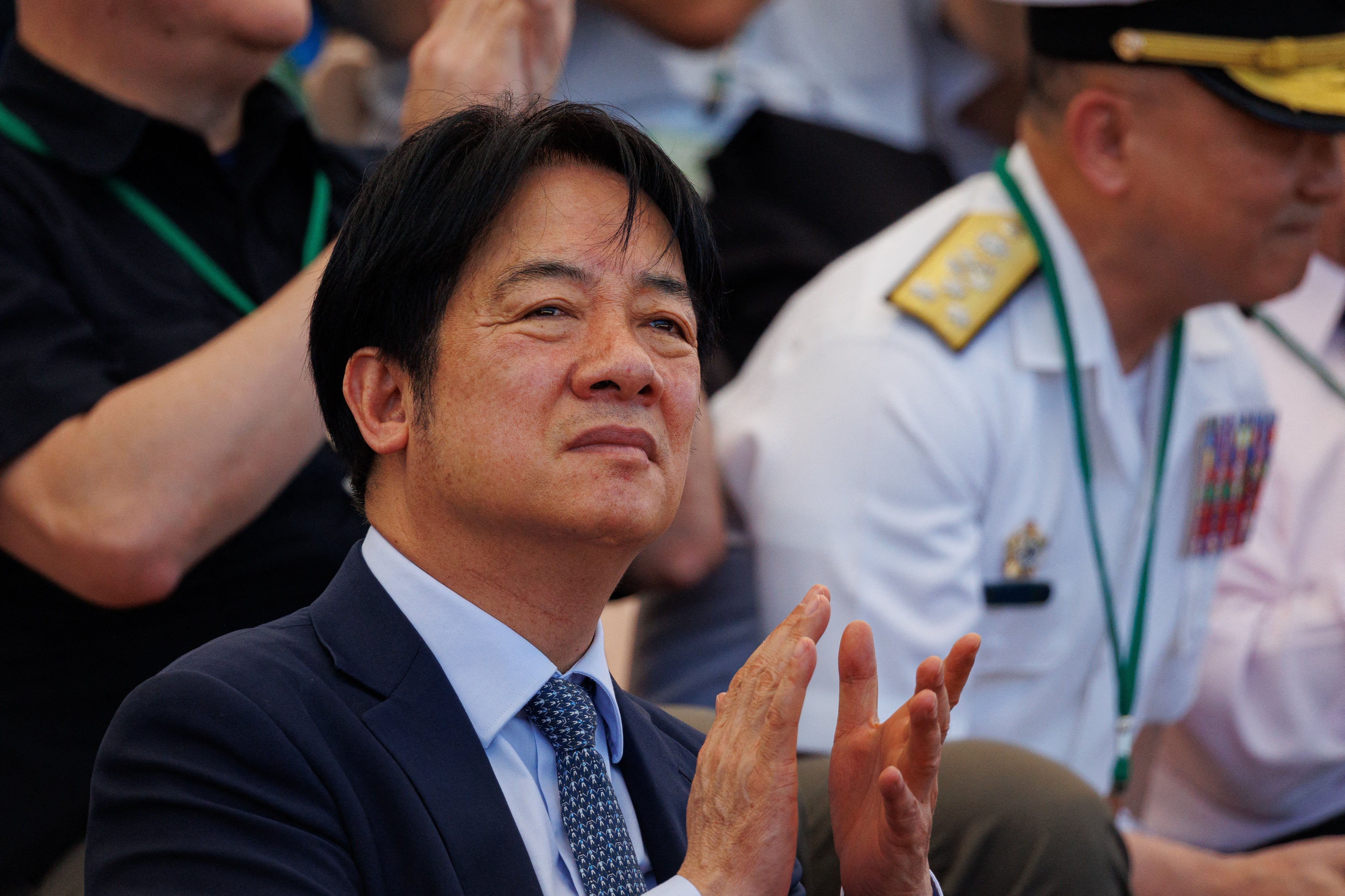Taiwanese President Lai Ching-te (C) attends the 
