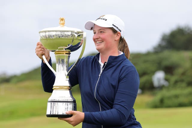 England’s Lottie Woad holds the trophy after her victory on Sunday (Steve Welsh/PA)