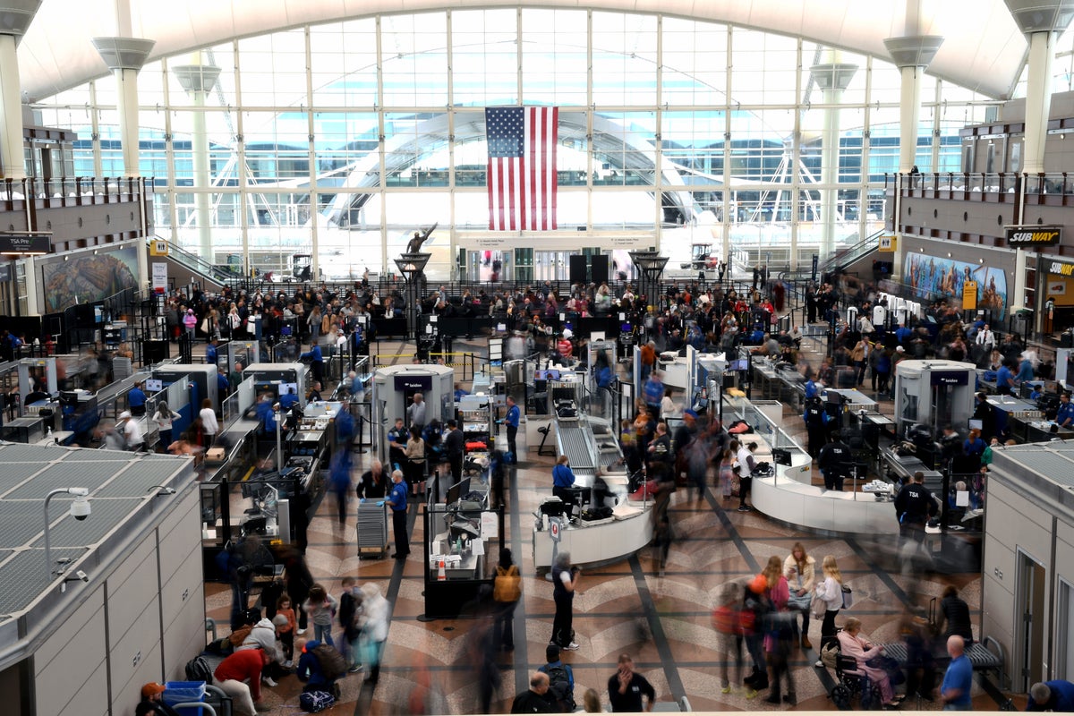 Passengers flee smoking jet on emergency slide after issue at Denver airport