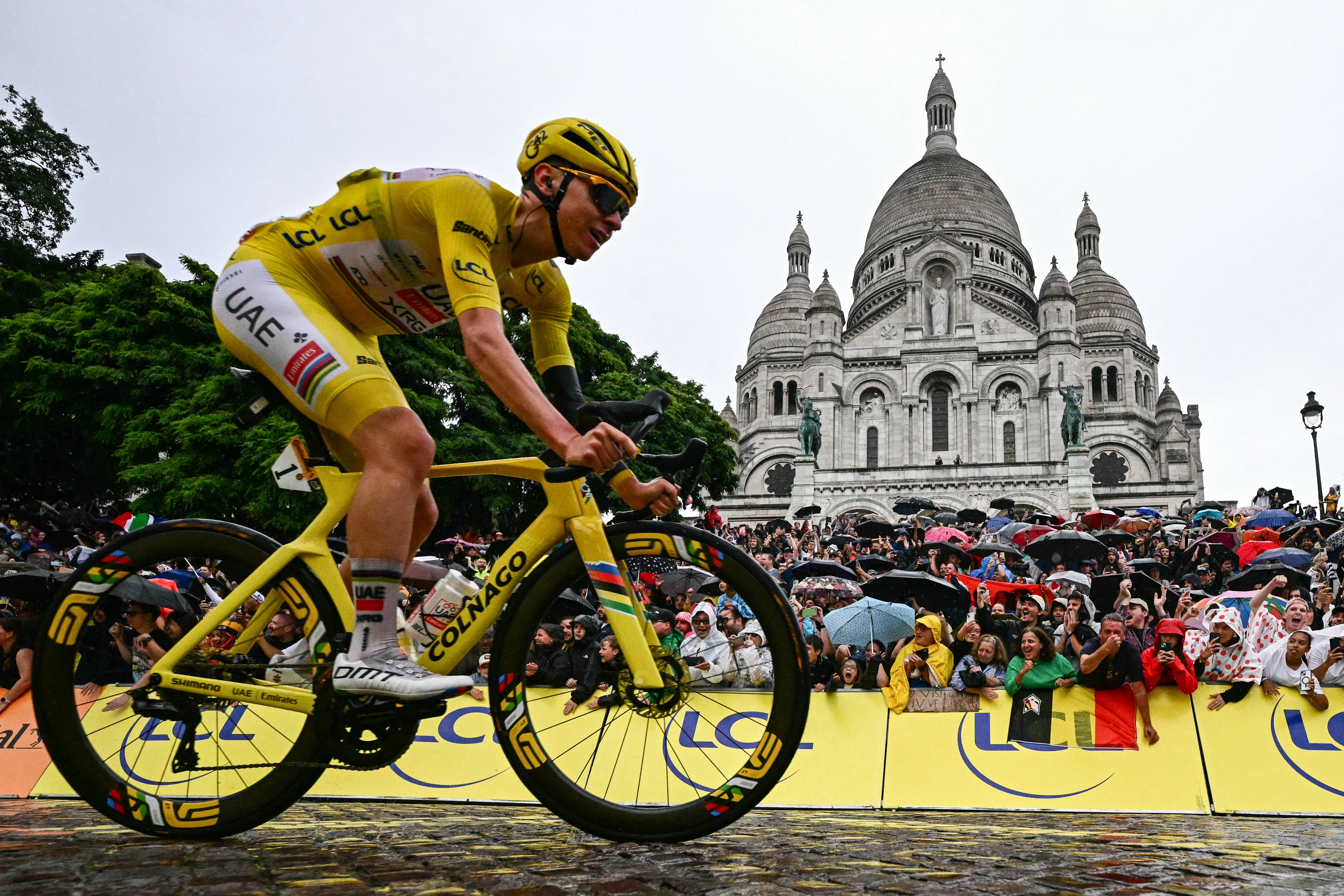 Pogacar had been in the running for a famous victory on the Champs-Elysees