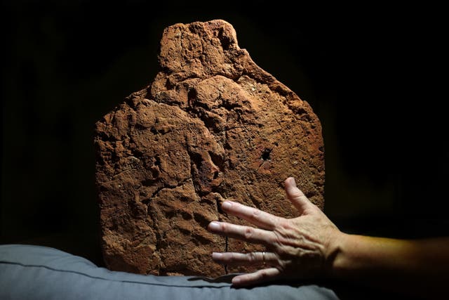 <p>A 4,000-year-old ancient Egyptian handprint discovered on a 'soul house' at the Fitzwilliam Museum in Cambridge ahead of their forthcoming exhibition Made in Ancient Egypt, which opens in October</p>