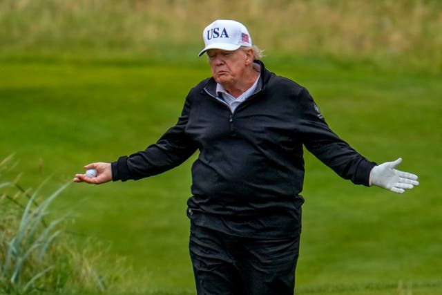 <p>Social media users claim a clip shows Trump’s caddy move his ball during a round of golf in Scotland, the latest in a long string of allegations that the president cheats at golf</p>