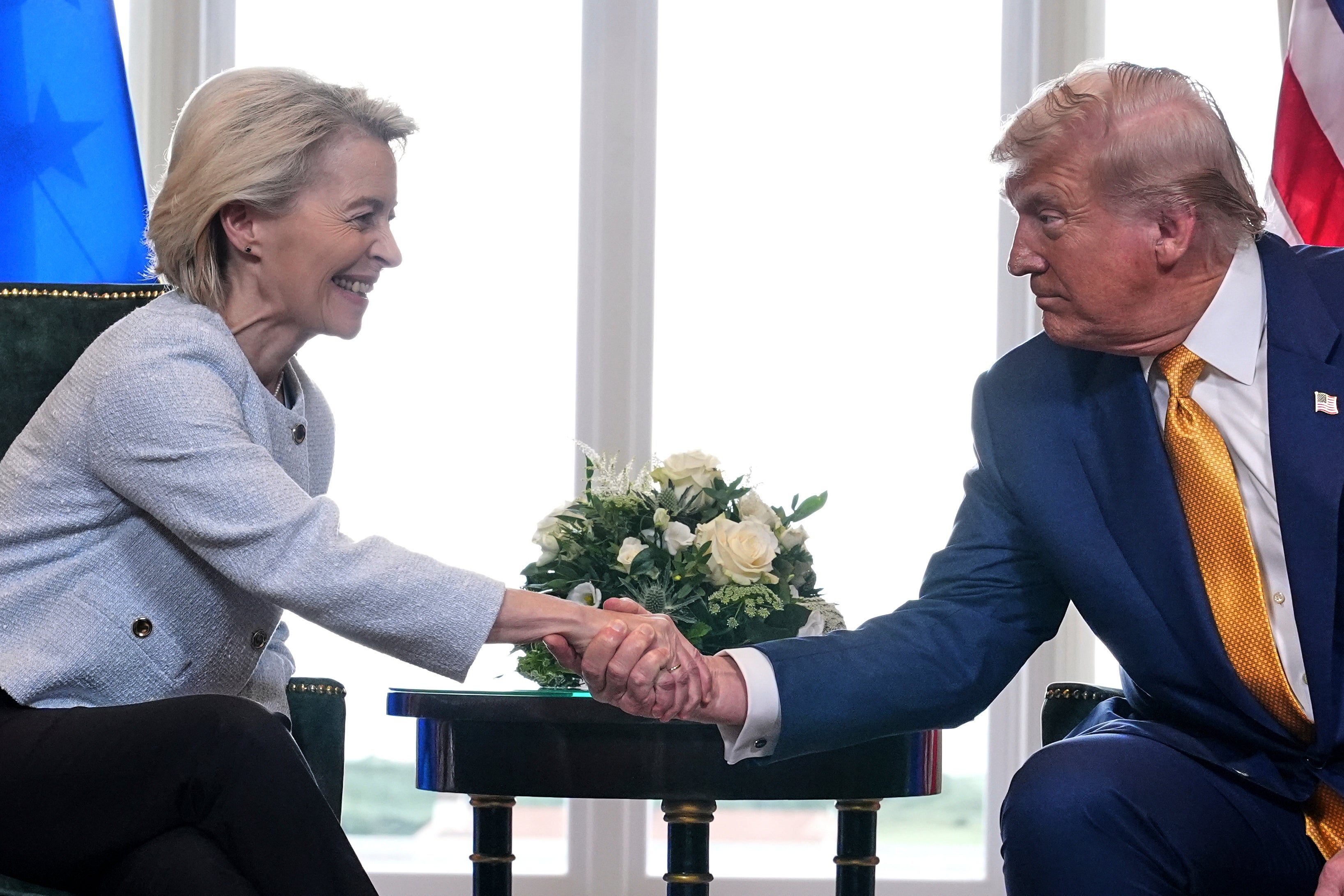 Donald Trump and Ursula von der Leyen shake hands after reaching a trade deal at the Trump Turnberry golf course, Scotland Sunday 27 July (AP Photo/Jacquelyn Martin)