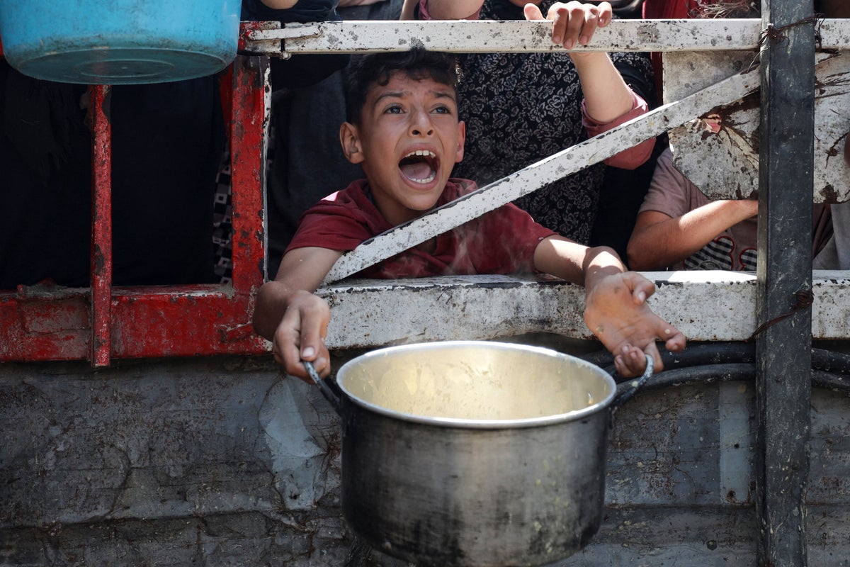 https://static.independent.co.uk/2025/07/28/10/22/Palestinians-wait-to-receive-food-from-a-charity-kitchen-in-Gaza-City-mf7nus7u.jpeg?trim=119,0,120,0&width=1200&height=800&crop=1200:800