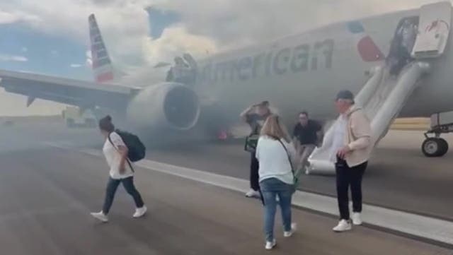 <p>Passengers evacuate American Airlines flight after Boeing 737 wheel catches fire</p>