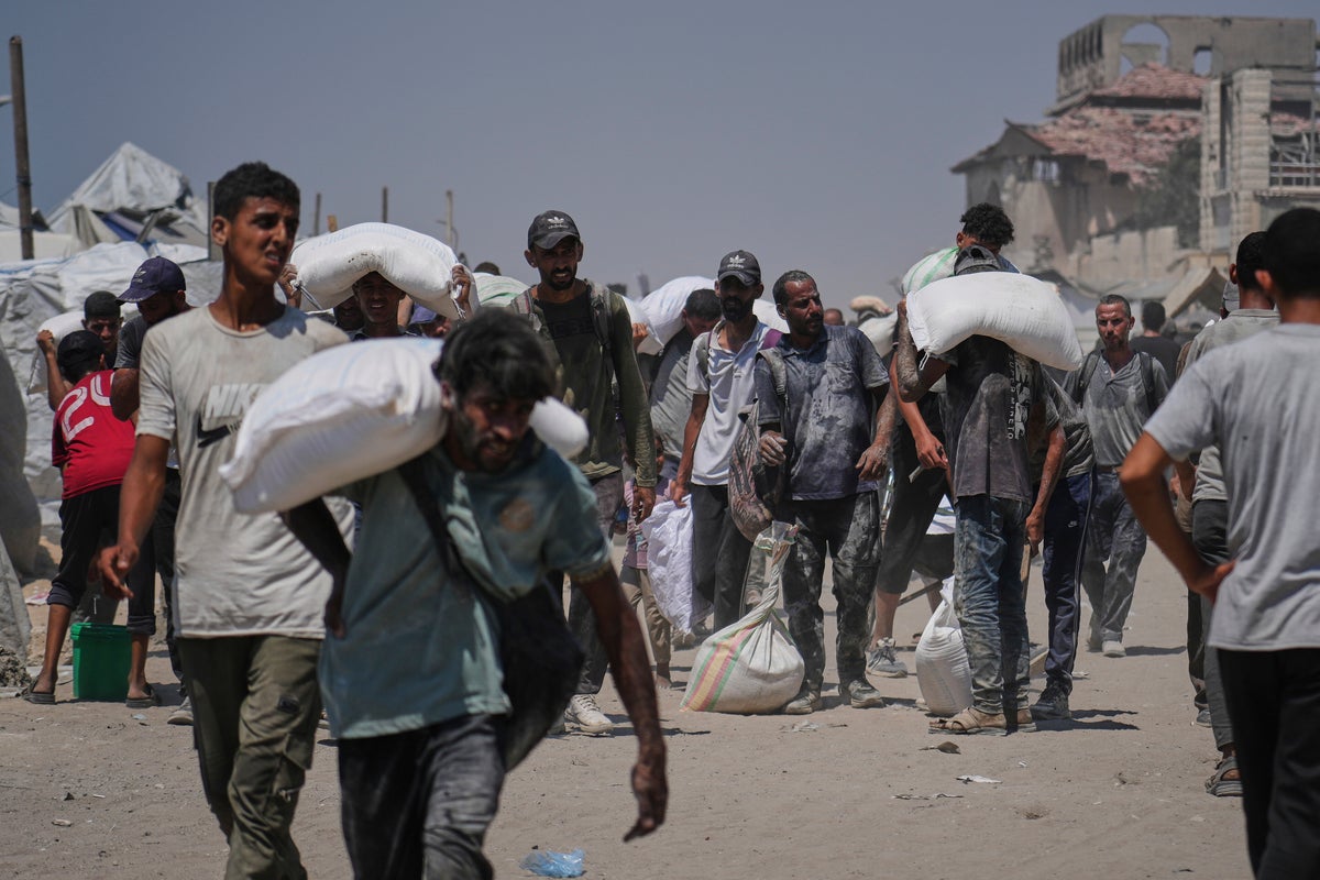 Israeli strikes kill at least 34 people in Gaza, officials say, as some aid restrictions are eased