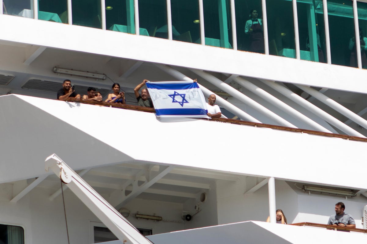 Anti-war demonstrators protest the arrival of an Israeli cruise ship on the Greek island of Crete