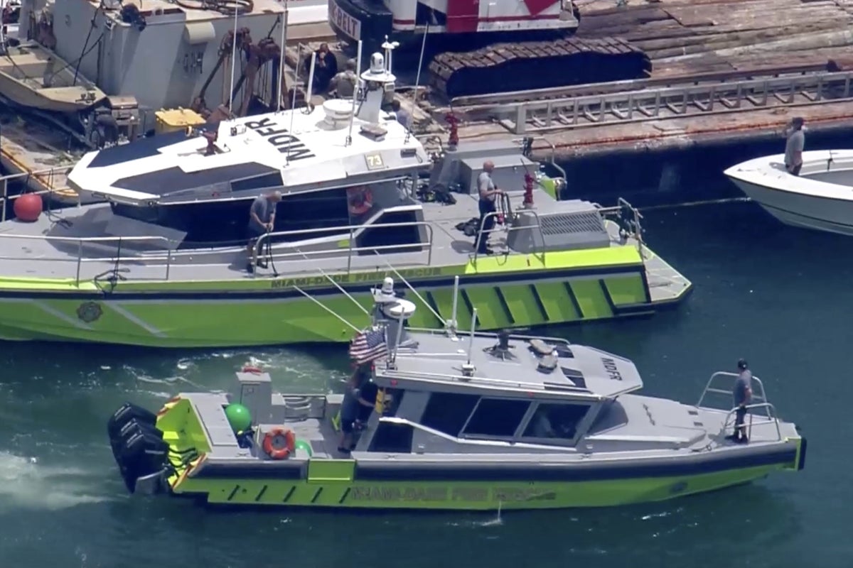 Coast Guard begins salvage operation and investigates cause of boat collision that killed two girls