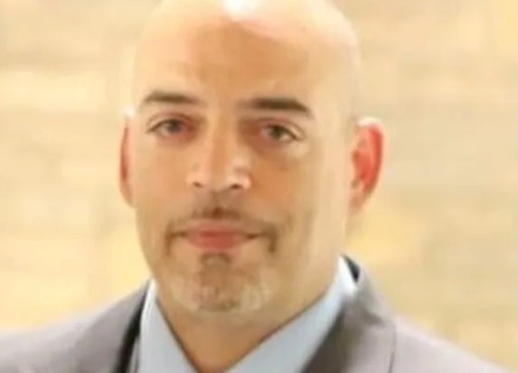 Andre Hill, 47, was holding a cellphone and keys when Adam Coy, who is white, shot him four times in a Columbus garage
