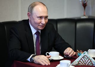 Vladimir Putin seen drinking tea aboard the Russian Navy frigate Admiral Grigorovich in Saint Petersburg