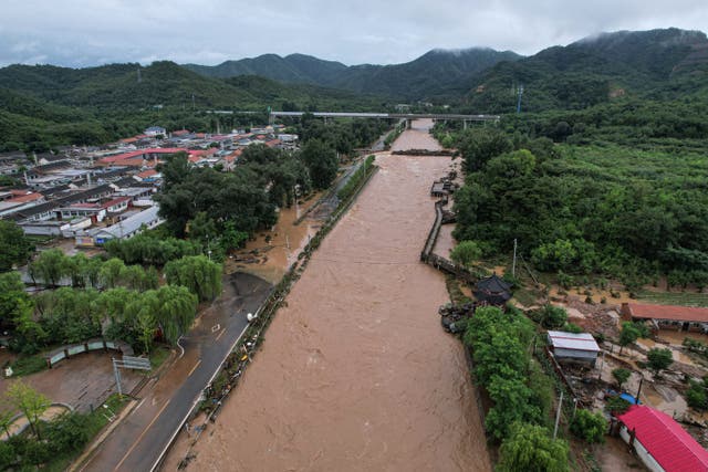 <p>An aerial view shows a flooded area following heavy rainfall at Xin’anzhuang village on the outskirts of Beijing on 28 July 2025</p>