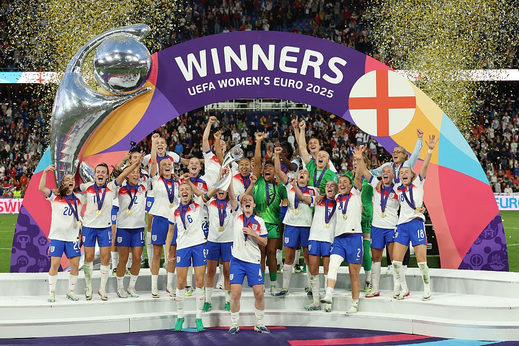 England players lift the trophy on the pitch at St Jakob Park