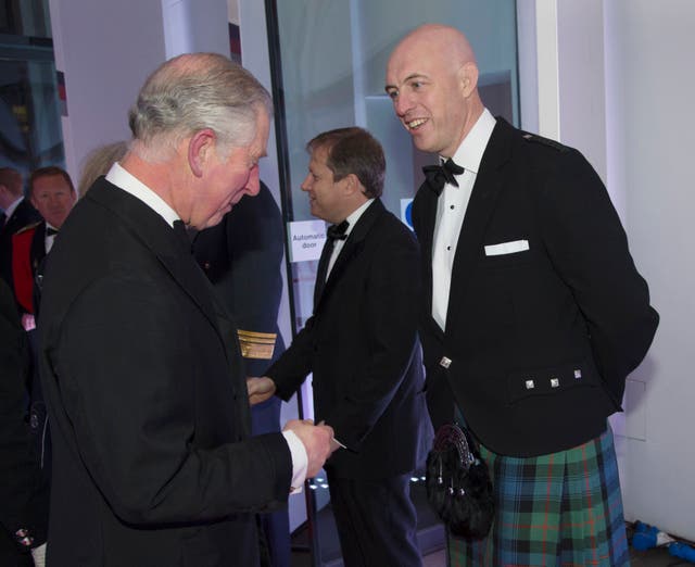 <p>David Dinsmore meets then-Prince Charles in 2014</p>