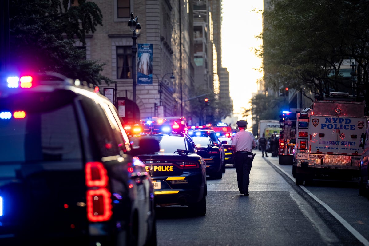 NYPD officer killed and gunman dead after opening fire inside Midtown office building where Blackstone and NFL based