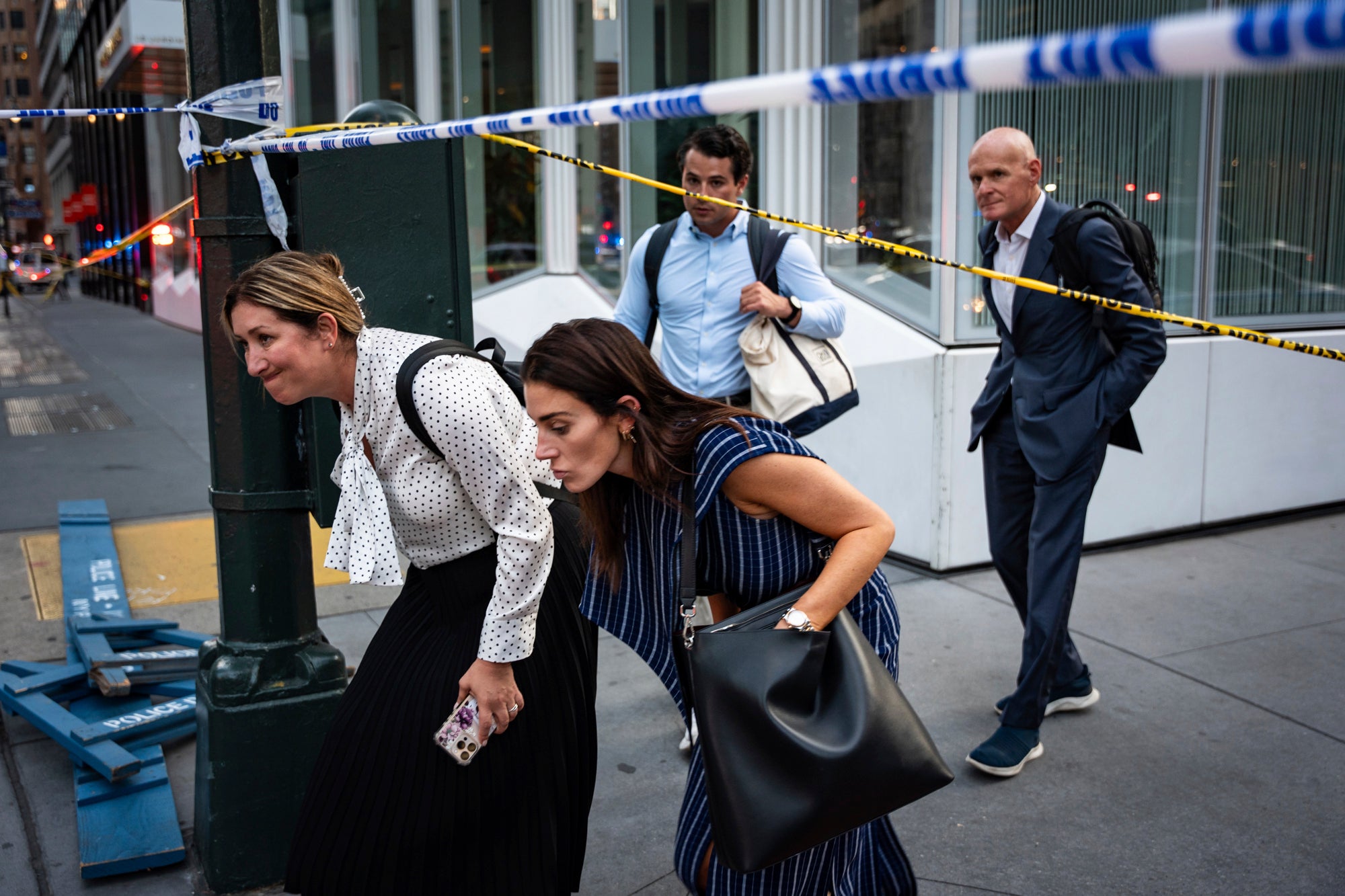 Bystanders described hearing a wave of gunshots and barricading themselves inside high-rise officers during incident