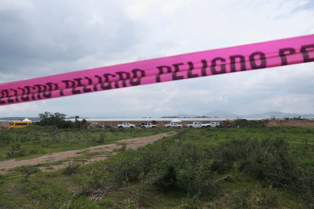 <p>Danger warning tape stretches along a Nextipac ranch where prosecutors say bodies were discovered in a mass grave during excavations for the construction, in the Zapopan municipality, Jalisco state, Mexico</p>