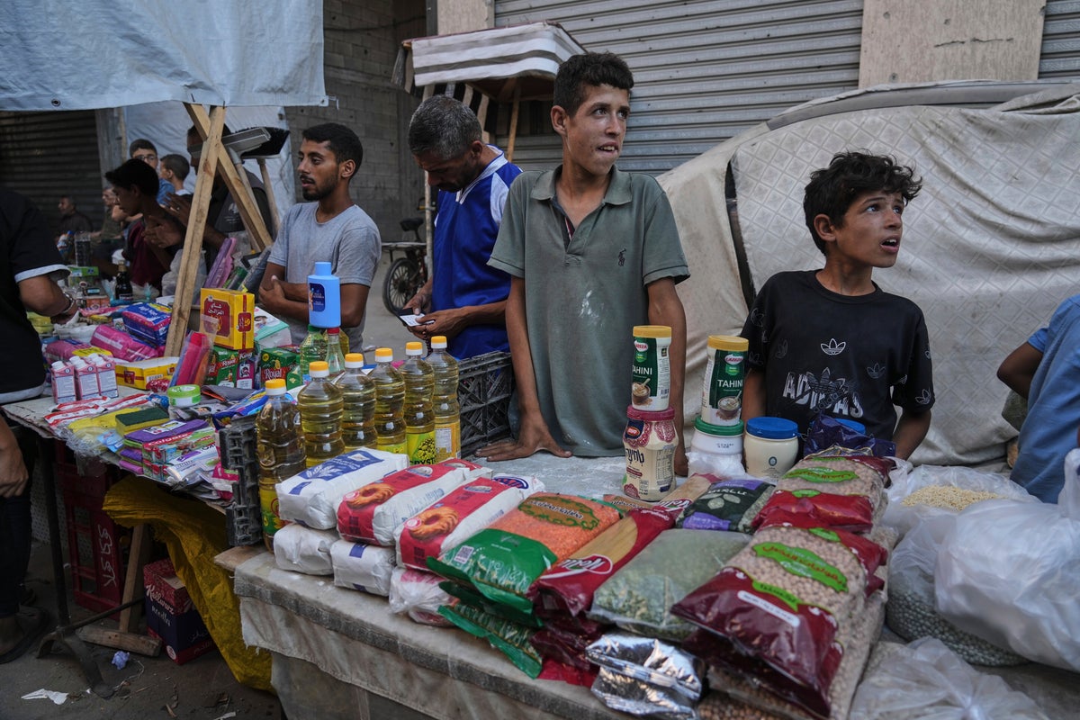 Gangs and merchants sell food aid in Gaza, where Israel’s offensive has shattered security