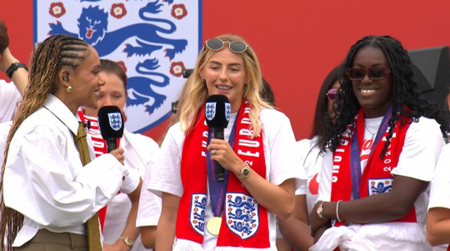 <p>Chloe Kelly takes to the stage to thank supporters during the Lionesses victory parade </p>