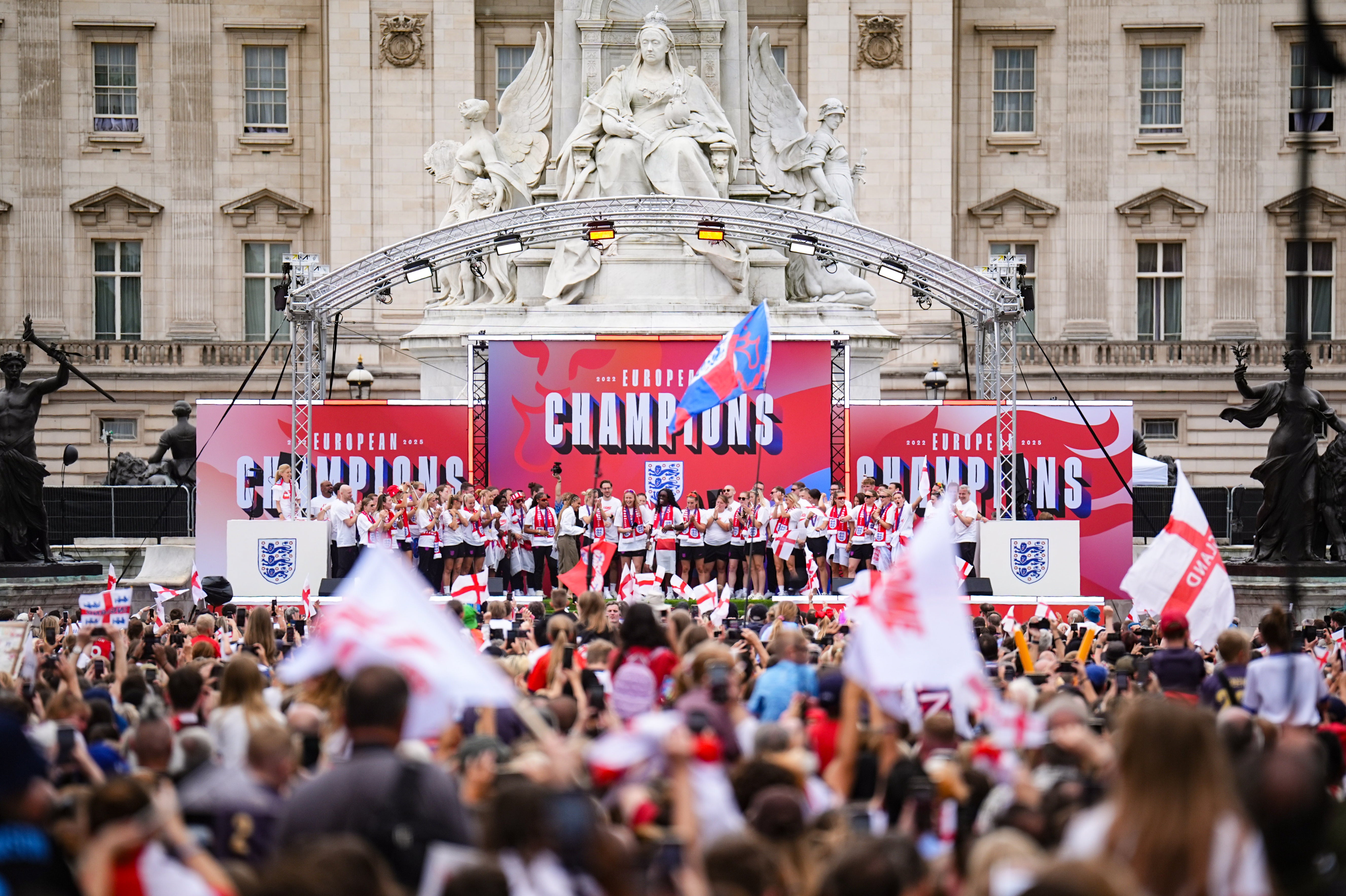 England on stage during their Homecoming Victory Parade