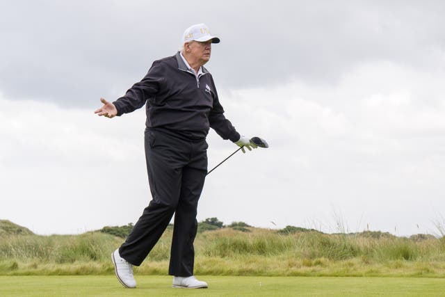 <p>US President Donald Trump after hitting a ball off the first tee to officially open the New Course, the second championship course at Trump International Golf Links, on the Menie Estate in Balmedie, Aberdeenshire</p>