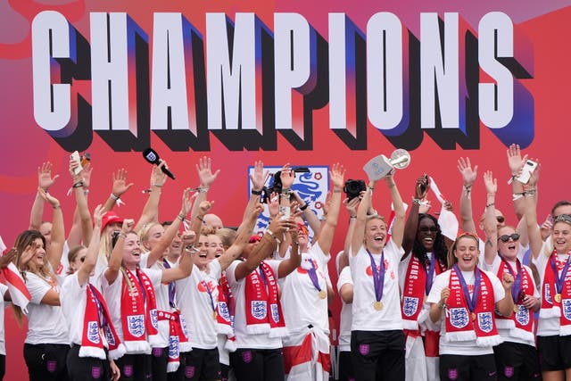 <p>Captain Leah Williamson led the celebrations in front of the Queen Victoria Memorial (Gareth Fuller/PA)</p>