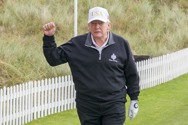 <p>Donald Trump hit the first ball at his new course (Jane Barlow/PA)</p>