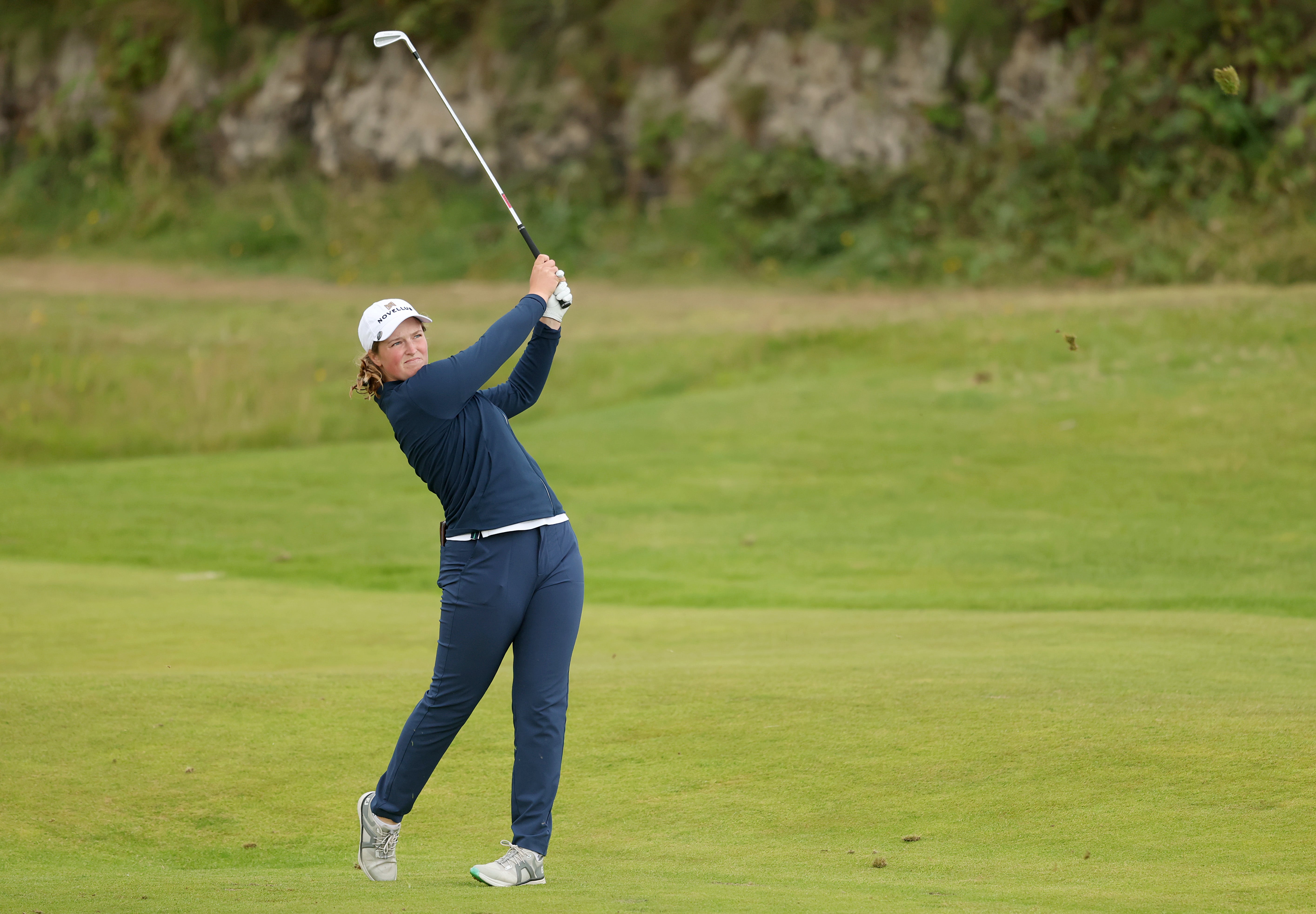 Lottie Woad of England plays her second shot on the 13th hole