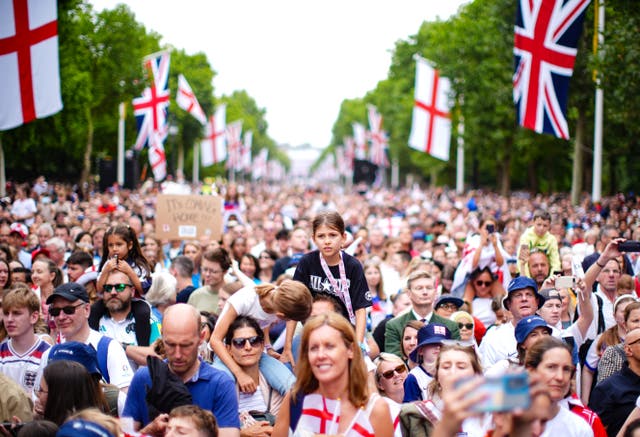 <p>Fans gather around the stage on The Mall  (James Manning/PA)</p>