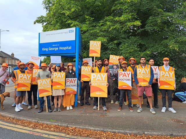<p>NHS resident doctors protest outside  outside the King George Hospital in London</p>