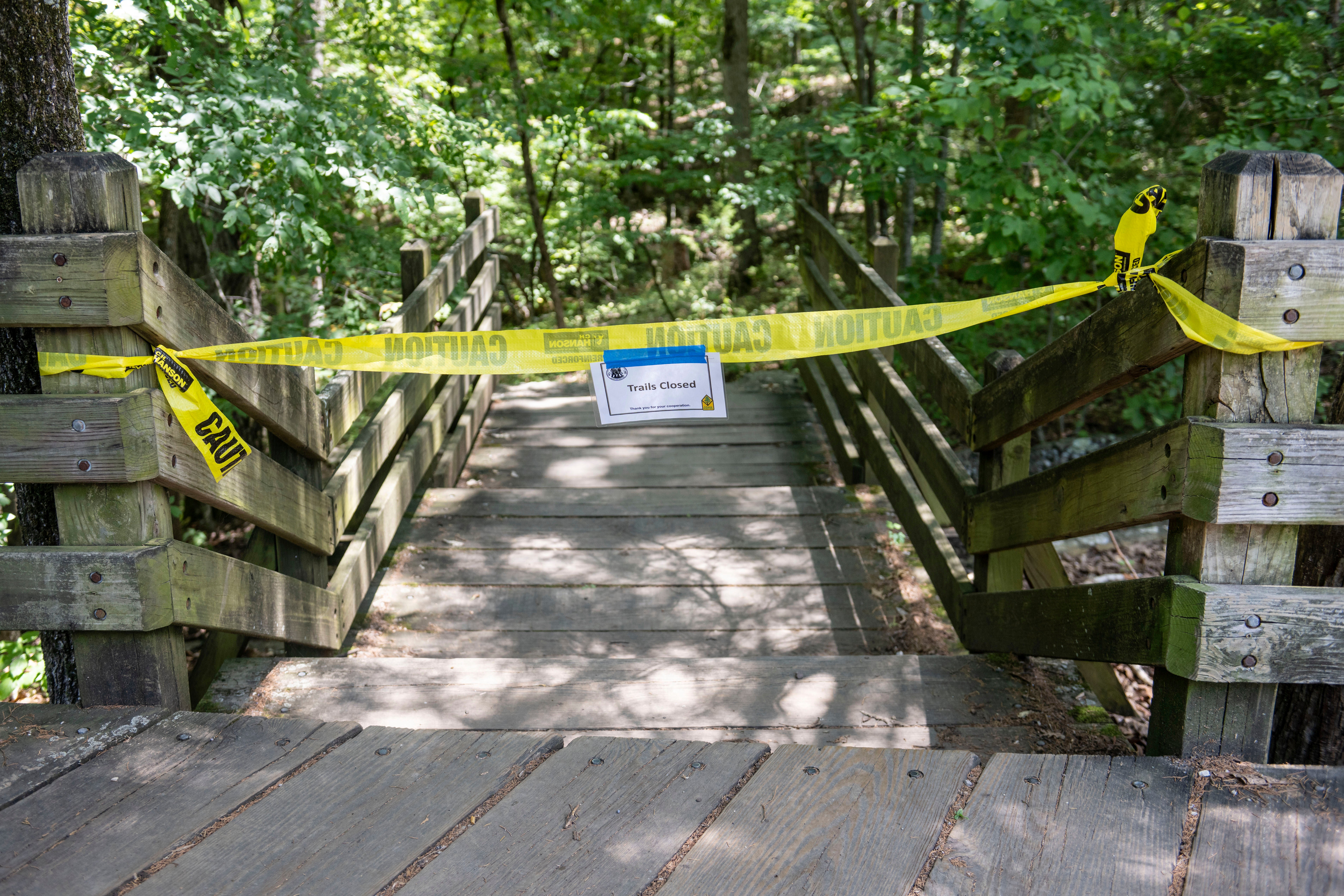 The trail head to the Devil's Den trail at Devils Den State Park remains closed