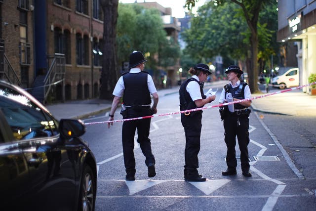 <p>Police on Long Lane, Southwark, after a stabbing</p>